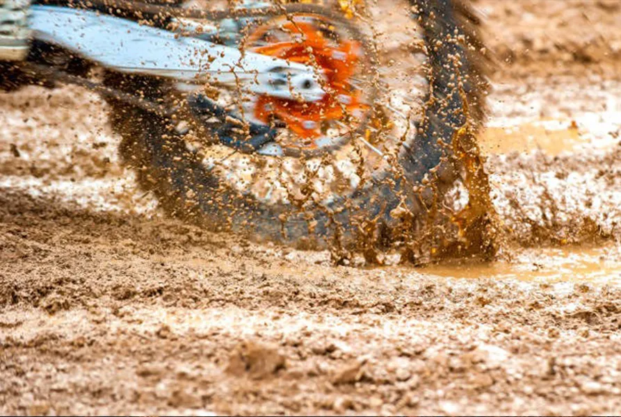 Motorcycle on a Muddy Road Motorcycle on a Muddy Road